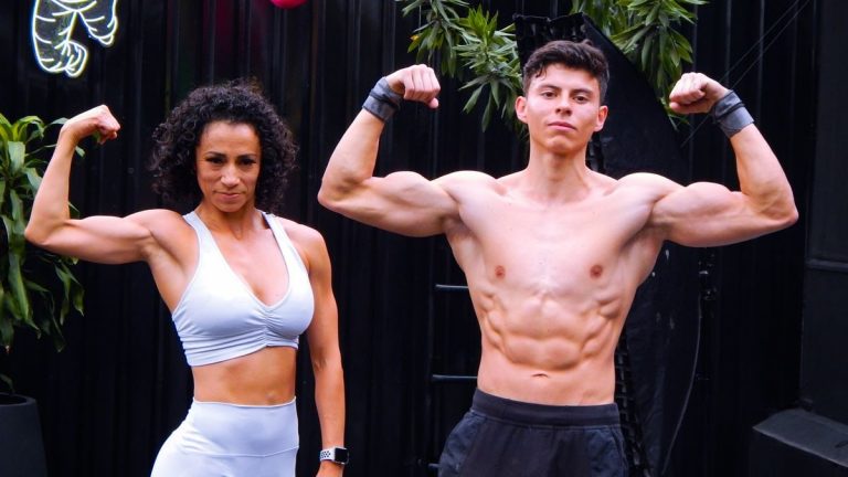 A fit man and woman flex muscles in activewear outdoors in Mexico City.